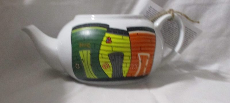 Newfoundland fishing stages painted on teapot in my Crooked Stages style