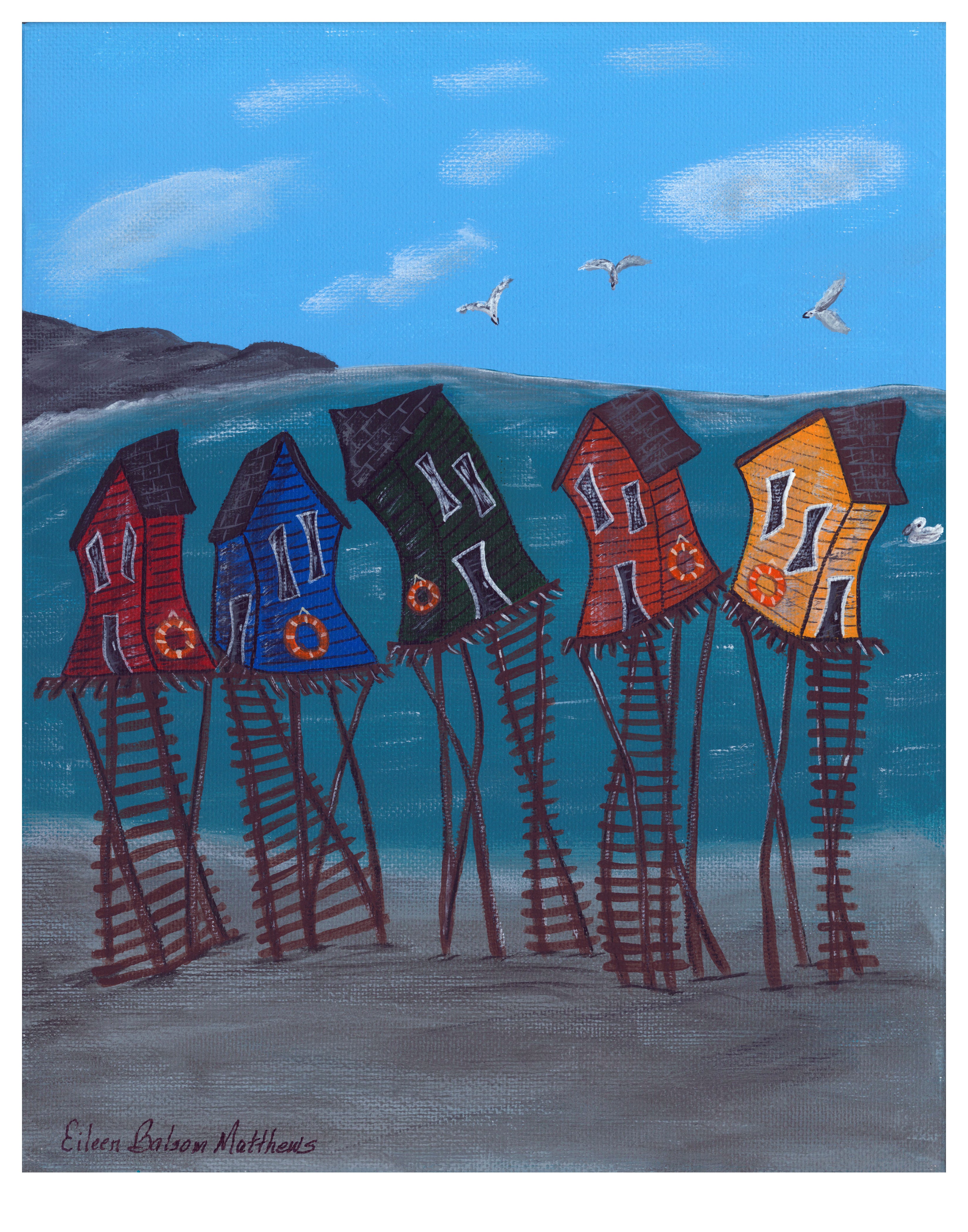 Colorful fishing stages painted whimsically crooked along the water.