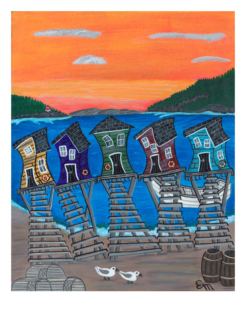 Colorful Newfoundland fishing shacks on stilts with a sunset sky and two birds in the foreground.