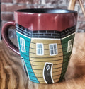 Mug with hand painted Jully Bean Rowhouse design, as seen in various areas of downtown St. John's, NL