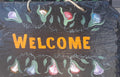 Welcome House sign with flowers